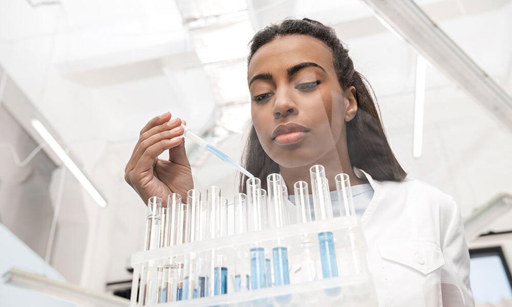 young-african-american-female-scientist explaining benefits of School Programs​